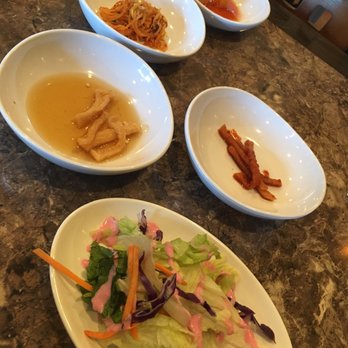 Buldaegi BBQ House - Side dishes: salad with house dressing, radish, bean, kimchi - Korean Near Me - Cary, North Carolina Buldaegi BBQ House - Side dishes: salad with house dressing, radish, bean, kimchi - Korean Near Me - Cary, North Carolina