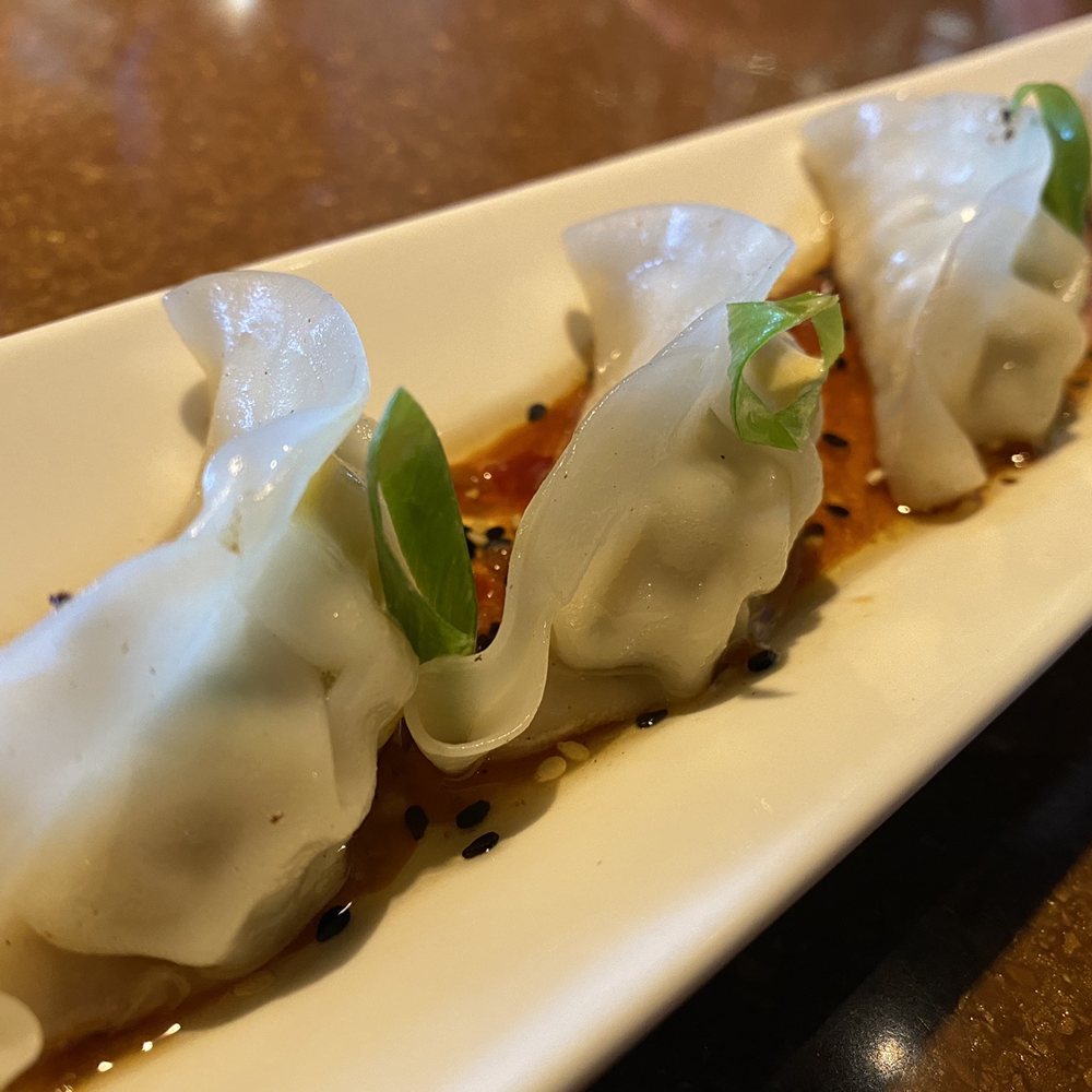 JOEY Mayfield - a plate of dumplings on a table - Canadian (New) Near Me - Edmonton, Alberta JOEY Mayfield - a plate of dumplings on a table - Canadian (New) Near Me - Edmonton, Alberta