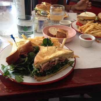 Frenchie's - Duck confit club in the forefront. Pulled chicken BLT on the right. The cheeseburger in the distance. - French Near Me - Coral Gables, Florida
