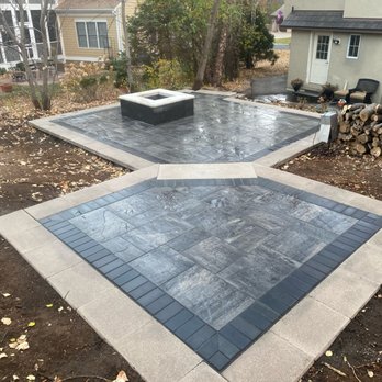 Hartigan Outdoors - a concrete patio with a fire pit - Snow Removal Near Me - Rosemount, Minnesota Hartigan Outdoors - a concrete patio with a fire pit - Snow Removal Near Me - Rosemount, Minnesota
