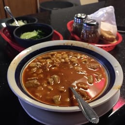a bowl of soup and a plate of bread a bowl of soup and a plate of bread