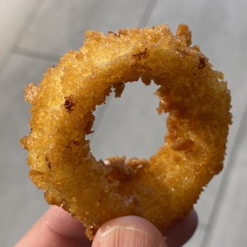 Carl’s Jr - a hand holding a fried donut - Burgers Near Me - Edmonton, Alberta