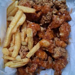 Gizzards dinner with mild sauce. Huge portion and delicious. Comes with fries and slaw.