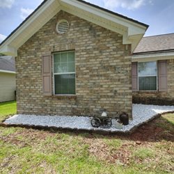 SheCUT's Lawn Care - After- customer wanted low maintenance bed with rocks