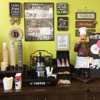 Royal King Donuts - a coffee shop counter with a statue of a chef - Donuts Near Me - Allen, Texas