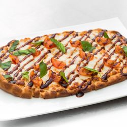 Nate Jackson’s Super Funny Comedy Club - Flatbread topped with tomatoes, mozzarella, basil, and a drizzle of balsamic glaze