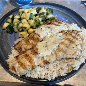 California Fish Grill - Rockfish plate with white rice and zucchini. - Seafood Near Me - Rialto, California California Fish Grill - Rockfish plate with white rice and zucchini. - Seafood Near Me - Rialto, California