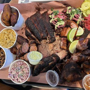 Bark Barbecue - Barbecue platter-rice, claw slaw, mac and cheese, sweet plantains, spicy sausage, chicarrón, brisket, smoked ribs, chicken - Barbeque Near Me - Brooklyn, New York Bark Barbecue - Barbecue platter-rice, claw slaw, mac and cheese, sweet plantains, spicy sausage, chicarrón, brisket, smoked ribs, chicken - Barbeque Near Me - Brooklyn, New York