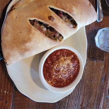 Mazzi's - Calzone with sauce on the side - Italian Near Me - Eugene, Oregon