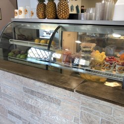 Churroland Cafe - Display case with fruits & parfaits.