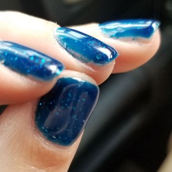 Red Persimmon - Not fully painted on the 3rd finger from the bottom to the top.. top finger has a circular scuff - Nail Salons Near Me - Riverside, California