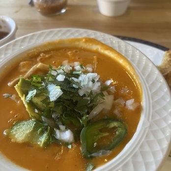1836 Texas Kitchen - Creamy tortilla soup with avocado chunks and a side of onions c cilantro, jalapeños and lime - Bars Near Me - Tyler, Texas 1836 Texas Kitchen - Creamy tortilla soup with avocado chunks and a side of onions c cilantro, jalapeños and lime - Bars Near Me - Tyler, Texas