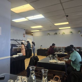 Puran Indian Restaurant - a man giving a presentation - Indian Near Me - Bloomington, Illinois Puran Indian Restaurant - a man giving a presentation - Indian Near Me - Bloomington, Illinois