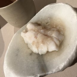 White fish with sea cucumber. Has a strong fishy taste, matching w a white sauce that was disgusting. White fish with sea cucumber. Has a strong fishy taste, matching w a white sauce that was disgusting.