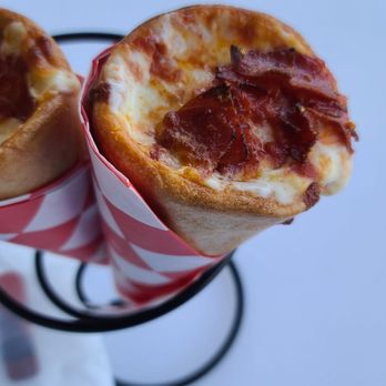 Kono Pizza - two pieces of pizza wrapped in red and white paper - Pizza Near Me - Wildwood, New Jersey