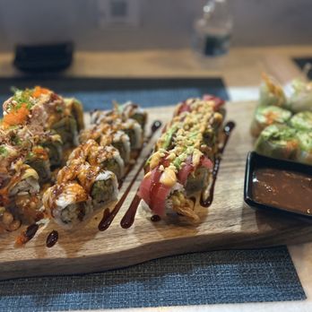 BluWave Sushi - sushi rolls on a cutting board with dipping sauce - Sushi Bars Near Me - Tampa, Florida BluWave Sushi - sushi rolls on a cutting board with dipping sauce - Sushi Bars Near Me - Tampa, Florida