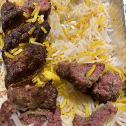 meat and rice in a tin foil container meat and rice in a tin foil container