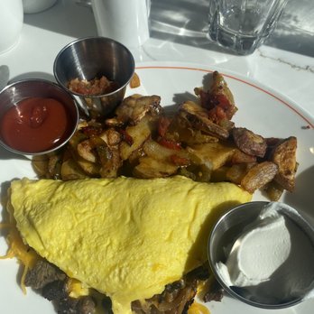 Cafe 44 - Fajita Omelette with salsa and sour cream on side! Big, quality omelette. Delicious ! - American Near Me - Alexandria, Virginia Cafe 44 - Fajita Omelette with salsa and sour cream on side! Big, quality omelette. Delicious ! - American Near Me - Alexandria, Virginia
