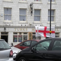 Turks Head Hotel - store front obscured by English flag