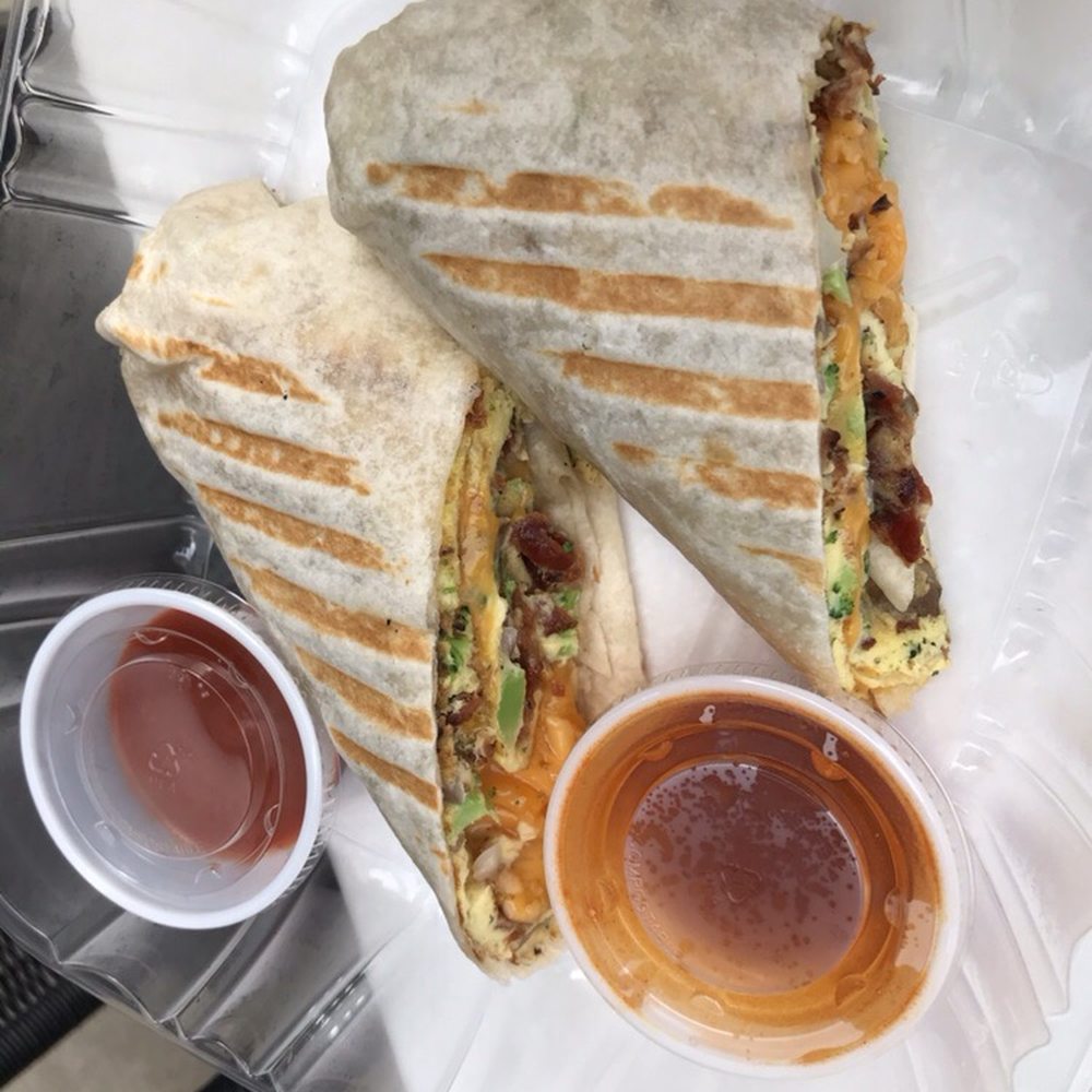 a sandwich and a cup of ketchup