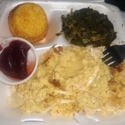 Turkey and dressing with greens, cornbread, and cranberry sauce
