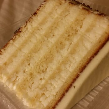 Peninsula Grill - Famous Ultimate Coconut Cake taken to-go - New American Near Me - Charleston, South Carolina Peninsula Grill - Famous Ultimate Coconut Cake taken to-go - New American Near Me - Charleston, South Carolina