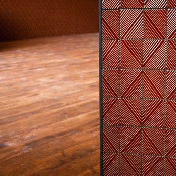 The Construct Group - a wooden floor and a red wall - General Contractors Near Me - Easton, Pennsylvania