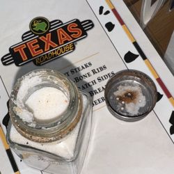 Rusted salt shaker on the table and in the salt