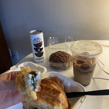 La Concha - Spinach and feta croissant, chocolate la concha, iced large latte, chocolate coconut water - Bakeries Near Me - Colorado Springs, Colorado La Concha - Spinach and feta croissant, chocolate la concha, iced large latte, chocolate coconut water - Bakeries Near Me - Colorado Springs, Colorado
