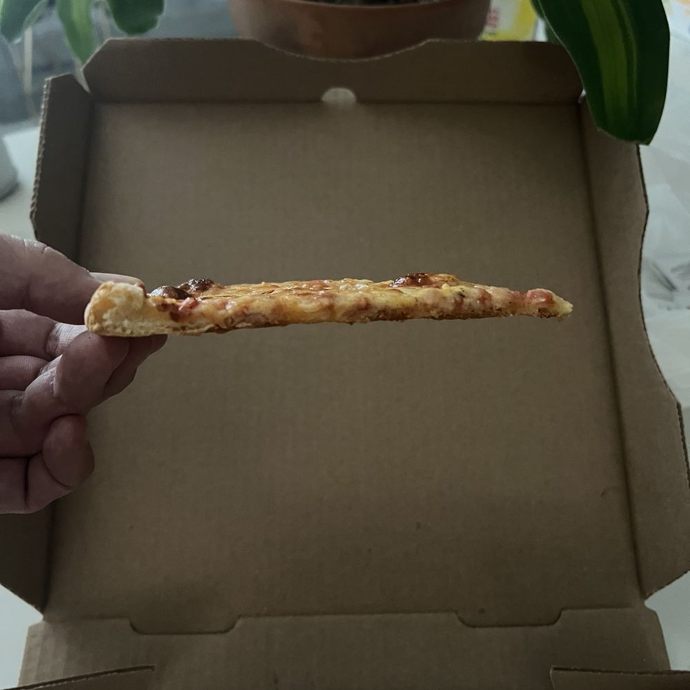 No rise to the crust and stiff as a board!