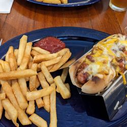 Kevin's Sports Pub & Restaurant - Half of the 2 hot dog entree (fries included). Excellent presentation with even better tasi!