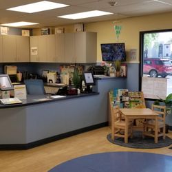 Sunrise Preschools - A cozy and inviting lobby, complete with comfortable seating and a colorful bulletin board showcasing heartwarming moments fr...