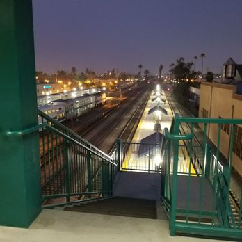 Riverside - Downtown Metrolink Station - Early morning for first Metrolink train. Parked underneath a tree in the secure looking parking lot. - Public Transportation Near Me - Riverside, California
