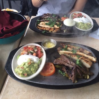 Guapo's Cocina & Bar - Combination fajitas still sizzling!! - Mexican Near Me - Gaithersburg, Maryland