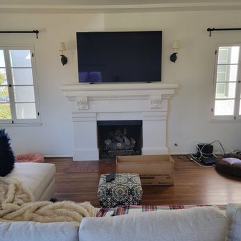 ANM Installs - Before on feet sitting on mantel. - Home Theatre Installation Near Me ANM Installs - Before on feet sitting on mantel. - Home Theatre Installation Near Me