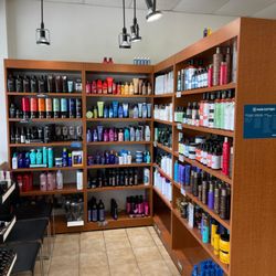 Hair Cuttery - The shelves with products available for purchase at a Hair Cuttery Salon.
