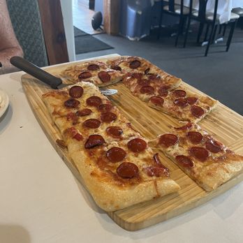 Ventura's Italian Kitchen & Wine Bar - Pepperoni Sicilian pizza (partially eaten) - Italian Near Me - Longboat Key, Florida Ventura's Italian Kitchen & Wine Bar - Pepperoni Sicilian pizza (partially eaten) - Italian Near Me - Longboat Key, Florida
