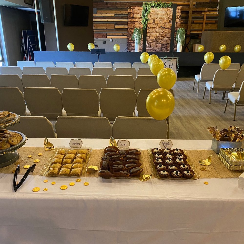 a table with desserts and balloons a table with desserts and balloons