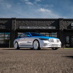 Posh Auto Styling - This Client went with a two done wrap, white painted chrome accents, and 22" Urban Forged wheels to complete its full build