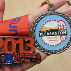 Pleasanton Half Marathon and 5k Fun Run - Hubby's 5k Double medals. The 5k medal is so cheap and flimsy where the duel medal is smaller.