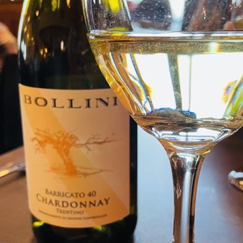Trattoria Di Sofia - a glass of wine and a bottle of wine - Italian Near Me - Montrose, Colorado