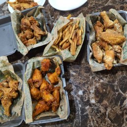 four trays of food on a table four trays of food on a table
