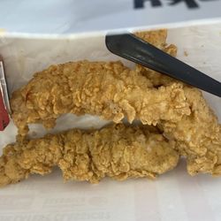 KFC - This is the remaining two  pieces of four chicken tenders. They were served at the proper temperature and were very moist.