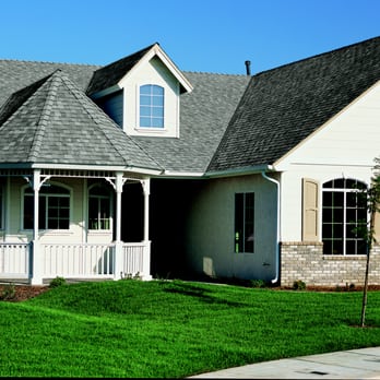 ReNue Roofing - a white house with a gray roof - Roofing Near Me - Seattle, Washington ReNue Roofing - a white house with a gray roof - Roofing Near Me - Seattle, Washington