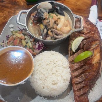 Perico Ripiao Latin Food - Fried Red snipper fish , mixed seafood with white rice and pink beans. - Dominican Near Me - Kissimmee, Florida Perico Ripiao Latin Food - Fried Red snipper fish , mixed seafood with white rice and pink beans. - Dominican Near Me - Kissimmee, Florida