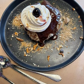 Hazel's - Wrecking Ball - vanilla ice cream covered in trail mix/toffee topped with fudge and a cherry. Larger than it looks here! - Bars Near Me - Birmingham, Michigan