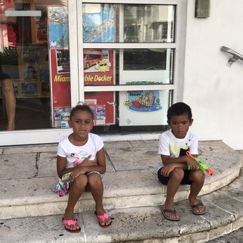 Miami Tours - Kids waiting for the shuttle which turned out to be a bus to take us to another location to pay more - Bus Tours Near Me - Miami Beach, Florida Miami Tours - Kids waiting for the shuttle which turned out to be a bus to take us to another location to pay more - Bus Tours Near Me - Miami Beach, Florida