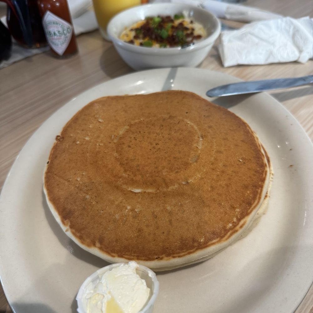 Himes Breakfast House - Regular pancakes (2) and loaded grits in the background. - Breakfast & Brunch Near Me - Riverview, Florida Himes Breakfast House - Regular pancakes (2) and loaded grits in the background. - Breakfast & Brunch Near Me - Riverview, Florida