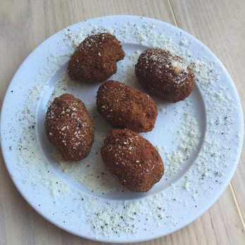 Uccellino - Fried olives and pork sausage - Italian Near Me - Edmonton, Alberta Uccellino - Fried olives and pork sausage - Italian Near Me - Edmonton, Alberta