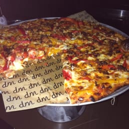 The absolute best pizza.  You can have it with a great but reasonably priced glass of wine in a fun New York environment!
